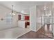 Bright dining area with tiled floor and a chandelier, leading to the kitchen at 242 Tradition Way, Rock Hill, SC 29732