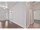 Inviting entryway with a white front door, hardwood floors and neutral walls, offering a warm welcome at 242 Tradition Way, Rock Hill, SC 29732