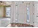 Bright foyer with hardwood floors and a view of a carpeted room with a fan at 242 Tradition Way, Rock Hill, SC 29732