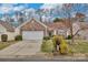 Charming single-story home with brick accents, a well-manicured lawn, and a two-car garage at 242 Tradition Way, Rock Hill, SC 29732
