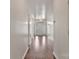 Hallway with hardwood floors leading to the front door with sidelights at 242 Tradition Way, Rock Hill, SC 29732