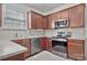 Modern kitchen featuring stainless steel appliances and ample cabinet space, perfect for cooking enthusiasts at 242 Tradition Way, Rock Hill, SC 29732