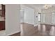 Open-concept living area featuring hardwood floors, neutral paint, and a glimpse of the kitchen at 242 Tradition Way, Rock Hill, SC 29732