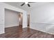 Bright living room with hardwood floors, white walls, and classic chair rail molding, enhancing the open space at 242 Tradition Way, Rock Hill, SC 29732