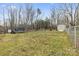 Large backyard featuring a shed, chainlink fence and mature trees at 244 Branchwood Cir, Kings Mountain, NC 28086