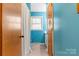 Cozy blue bathroom featuring a window and neutral shower curtain at 244 Branchwood Cir, Kings Mountain, NC 28086