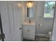 Bathroom featuring a modern vanity, mirror, light fixture, and a window for natural light at 245 College E Ave, Shelby, NC 28152