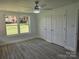 Spacious bedroom with large window, ceiling fan, and double closets, providing ample storage at 245 College E Ave, Shelby, NC 28152