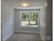 Bright bedroom with large window and updated flooring, freshly painted for a modern feel at 245 College E Ave, Shelby, NC 28152