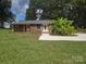 Charming brick home with a well-manicured lawn and a newly paved driveway at 245 College E Ave, Shelby, NC 28152