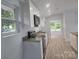 Bright kitchen featuring white cabinets, stainless steel appliances, granite countertops, and lots of natural light at 245 College E Ave, Shelby, NC 28152