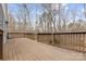 Large wooden deck showcasing serene views of the surrounding trees at 262 Vermont Dr, Stanley, NC 28164