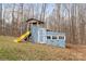 Backyard playhouse with a slide in a wooded lot at 262 Vermont Dr, Stanley, NC 28164