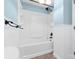 Clean white bathroom featuring a full tub and shower with white paneling at 262 Vermont Dr, Stanley, NC 28164