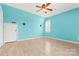 Bedroom with turquoise walls, wood floors, and a window at 262 Vermont Dr, Stanley, NC 28164