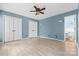 Spacious bedroom with two closets, light wood-look flooring, and a ceiling fan with lights at 262 Vermont Dr, Stanley, NC 28164