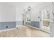 Dining area with white walls, blue trim, light-colored flooring, and sliding glass door at 262 Vermont Dr, Stanley, NC 28164