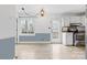 Open dining area with white walls, light-colored flooring, and sliding door to a deck at 262 Vermont Dr, Stanley, NC 28164