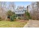 Charming two-story home with a metal roof, dormer windows, and well-maintained landscaping at 262 Vermont Dr, Stanley, NC 28164