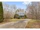 Charming two-story home with a metal roof, dormer windows, with a long driveway at 262 Vermont Dr, Stanley, NC 28164
