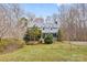 Charming two-story home with a metal roof, dormer windows, and well-maintained landscaping at 262 Vermont Dr, Stanley, NC 28164