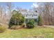 Charming two-story home with a metal roof, dormer windows, and well-maintained landscaping at 262 Vermont Dr, Stanley, NC 28164