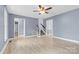 Inviting living room with a ceiling fan, light hardwood floors and staircase access to the upper level at 262 Vermont Dr, Stanley, NC 28164