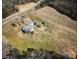 Aerial view of the property featuring the home, vehicles, and open fields at 28926 Hartsell Rd, Albemarle, NC 28001