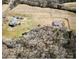 Aerial view of the property with the home, barn, and wooded areas at 28926 Hartsell Rd, Albemarle, NC 28001