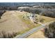 Wide aerial view of property, home, barn, and surrounding nature at 28926 Hartsell Rd, Albemarle, NC 28001