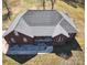 Aerial view of the brick home with rocking chair front porch and paved drive at 28926 Hartsell Rd, Albemarle, NC 28001