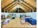 Attic featuring exposed wood rafters, plywood subfloor, and filled with boxes at 28926 Hartsell Rd, Albemarle, NC 28001