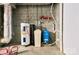 Unfinished basement featuring the home's water heater, water softener, and other utility systems at 28926 Hartsell Rd, Albemarle, NC 28001