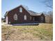 Classic brick home with an attached garage and a well-kept lawn at 28926 Hartsell Rd, Albemarle, NC 28001