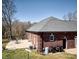 Brick home featuring a concrete patio and a well-manicured lawn at 28926 Hartsell Rd, Albemarle, NC 28001