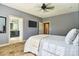 Serene main bedroom showcasing plush carpet, neutral walls, and an ensuite bathroom at 28926 Hartsell Rd, Albemarle, NC 28001