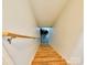 Bright staircase featuring a handrail, leading down to a lower level or basement at 28926 Hartsell Rd, Albemarle, NC 28001
