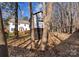 View of backyard with playhouse, lawn, and deck outside of two story white home with shuttered windows at 3017 Laurelwood Dr, Matthews, NC 28105