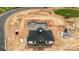 Aerial view of a new clubhouse and a pool under construction, with equipment on site at 3105 Beacon Heights Rd, Indian Land, SC 29707