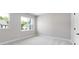 Bright, neutral bedroom features plush carpet and windows with backyard views, creating a peaceful retreat at 3105 Beacon Heights Rd, Indian Land, SC 29707