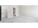 Neutral bedroom featuring soft carpeting, a closet, and an adjacent bathroom area with modern fixtures at 3105 Beacon Heights Rd, Indian Land, SC 29707