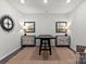 Dining area featuring statement clock, symmetrical artwork, and neutral rug at 3105 Beacon Heights Rd, Indian Land, SC 29707