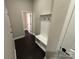 Entry hall with bench and coat rack, dark wood floor, and neutral walls at 3105 Beacon Heights Rd, Indian Land, SC 29707