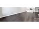 Expansive living area showcases dark hardwood floors and leads into a contemporary kitchen with white cabinets at 3105 Beacon Heights Rd, Indian Land, SC 29707