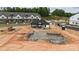 Aerial view of community pool under construction with modern homes in the background at 3105 Beacon Heights Rd, Indian Land, SC 29707