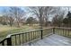 View of the expansive backyard from the wooden deck, with trees and grass at 350 Brawley Rd, Cleveland, NC 27013
