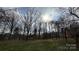 Expansive backyard with lush green grass and mature trees providing shade and privacy at 350 Brawley Rd, Cleveland, NC 27013