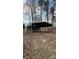 Metal carport providing covered space for vehicles and storage, set on a spacious lot at 350 Brawley Rd, Cleveland, NC 27013
