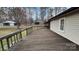 Wooden deck featuring a wooden railing with a view of the backyard and surrounding area at 350 Brawley Rd, Cleveland, NC 27013