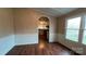 Dining room with wainscoting and hardwood floors flows into the kitchen at 350 Brawley Rd, Cleveland, NC 27013